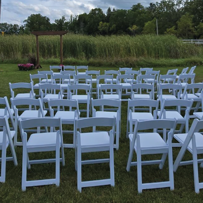 Outdoor wedding chair rentals arranged for ceremony events